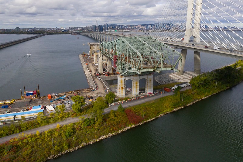 Aerial view of the deconstruction of the original Champlain Bridge’s cantilever section beside the new cable-stayed Samuel De Champlain Bridge in Montreal.
