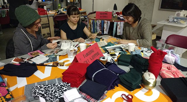 Students working around the furoshiki gift wrapping station