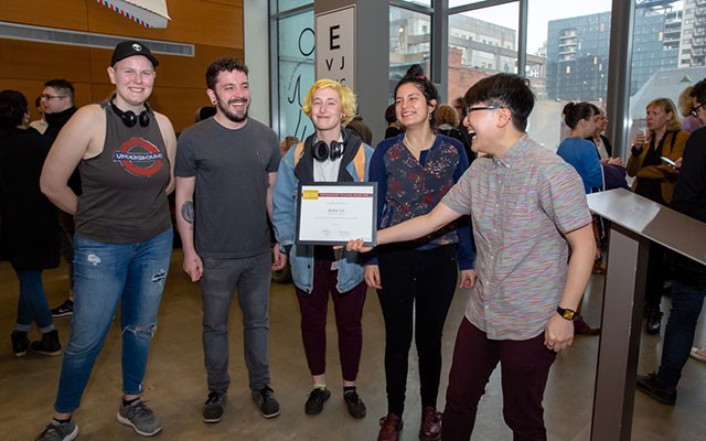 Part-time Professor Jenny Lin, studio arts, at the Fine Arts Distinguished Teaching Awards with students