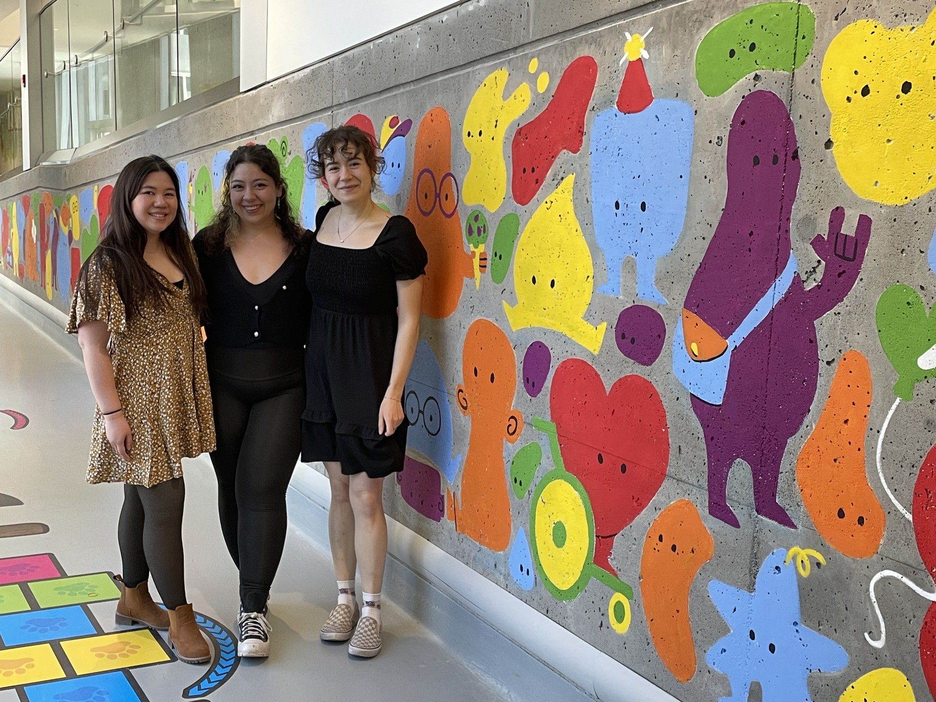 Art education students in front of Mackay Centre Mural