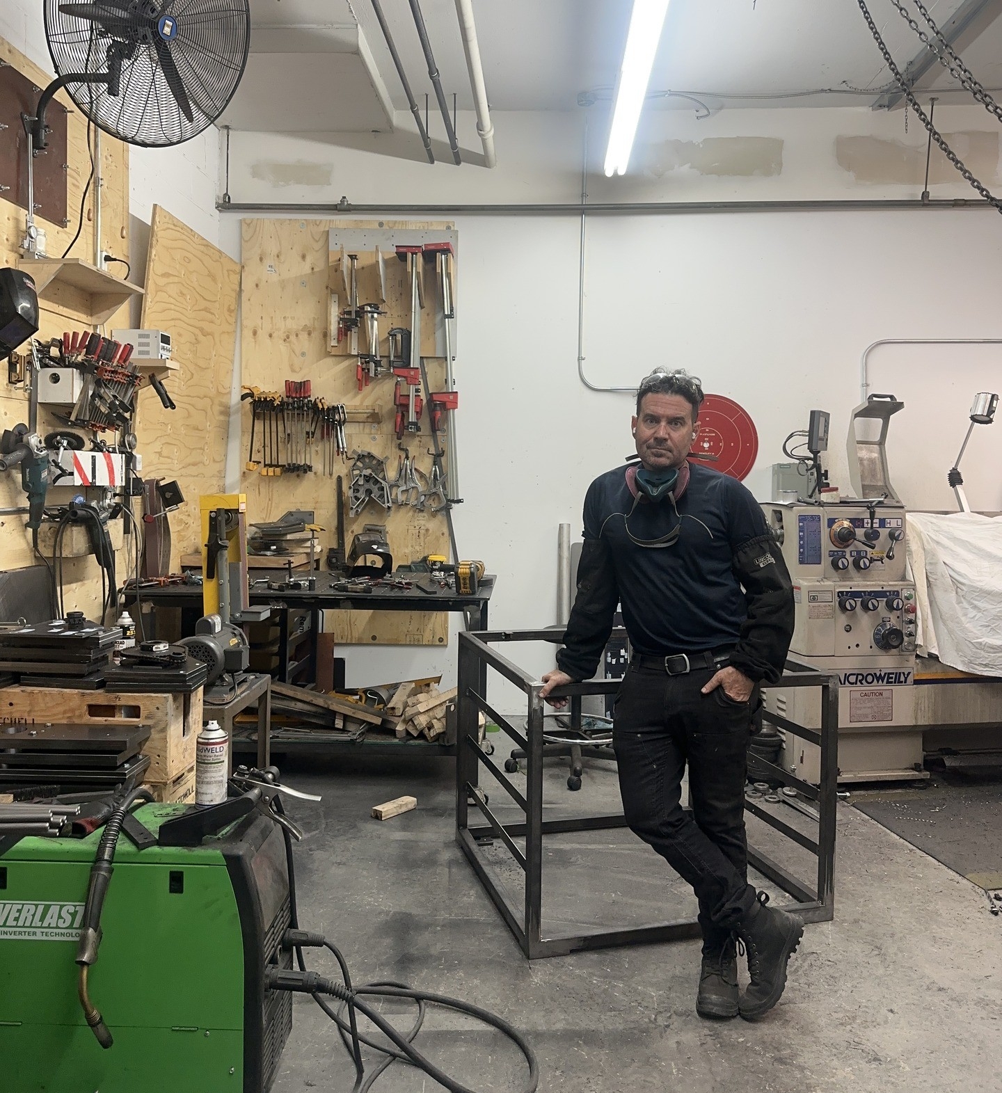 Prof Mitch Mitchell in his studio Man in art studio.