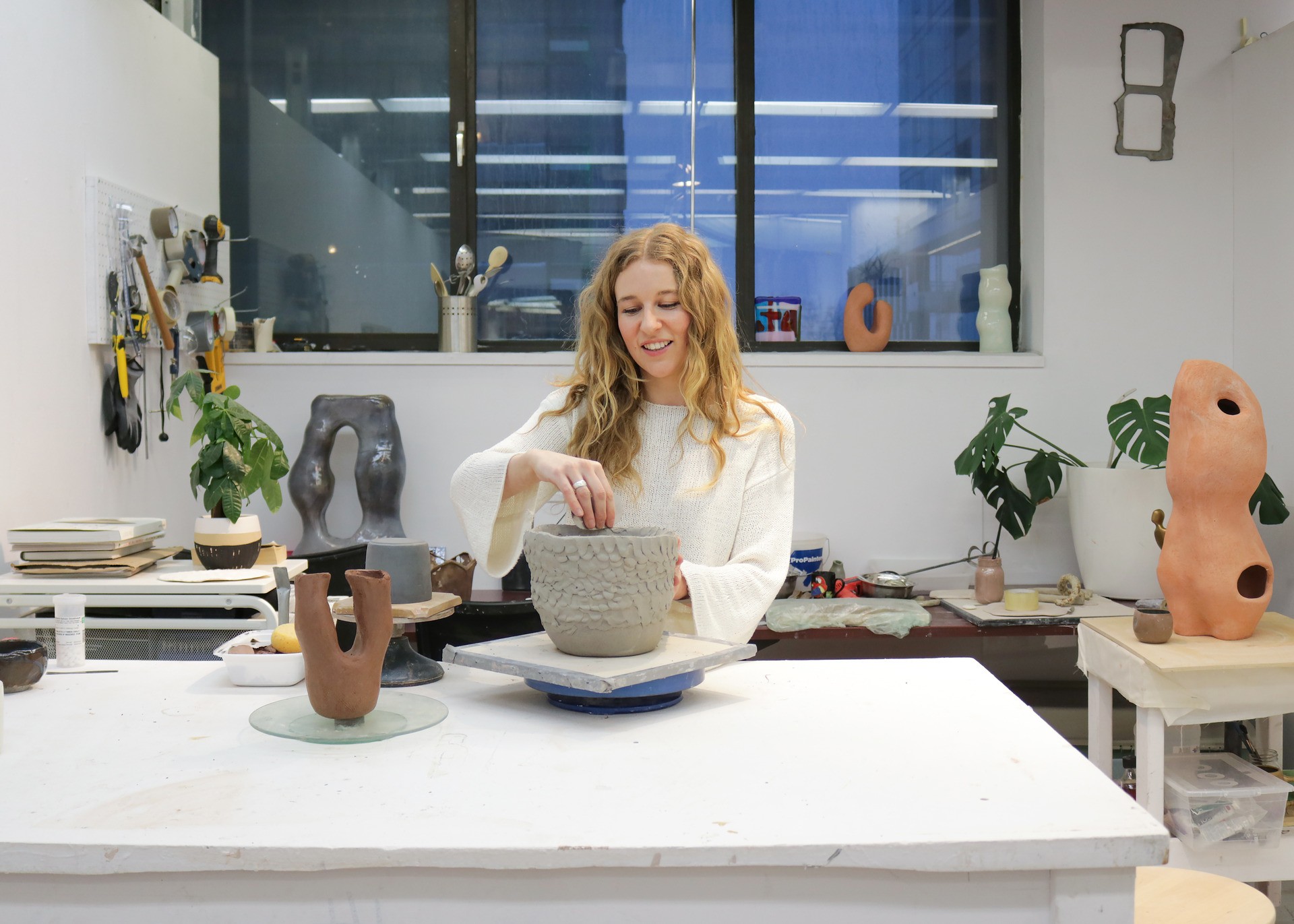 Teresa Dorey in her studio at Concordia woman in scupture studio