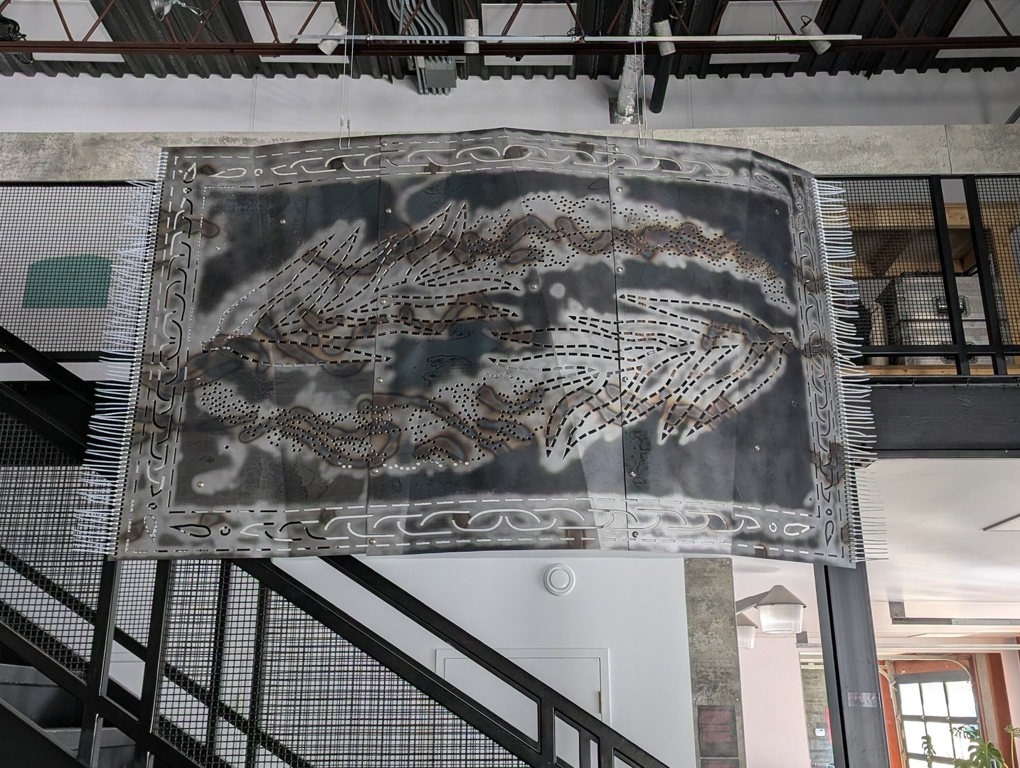 Metal carpet-like sculpture