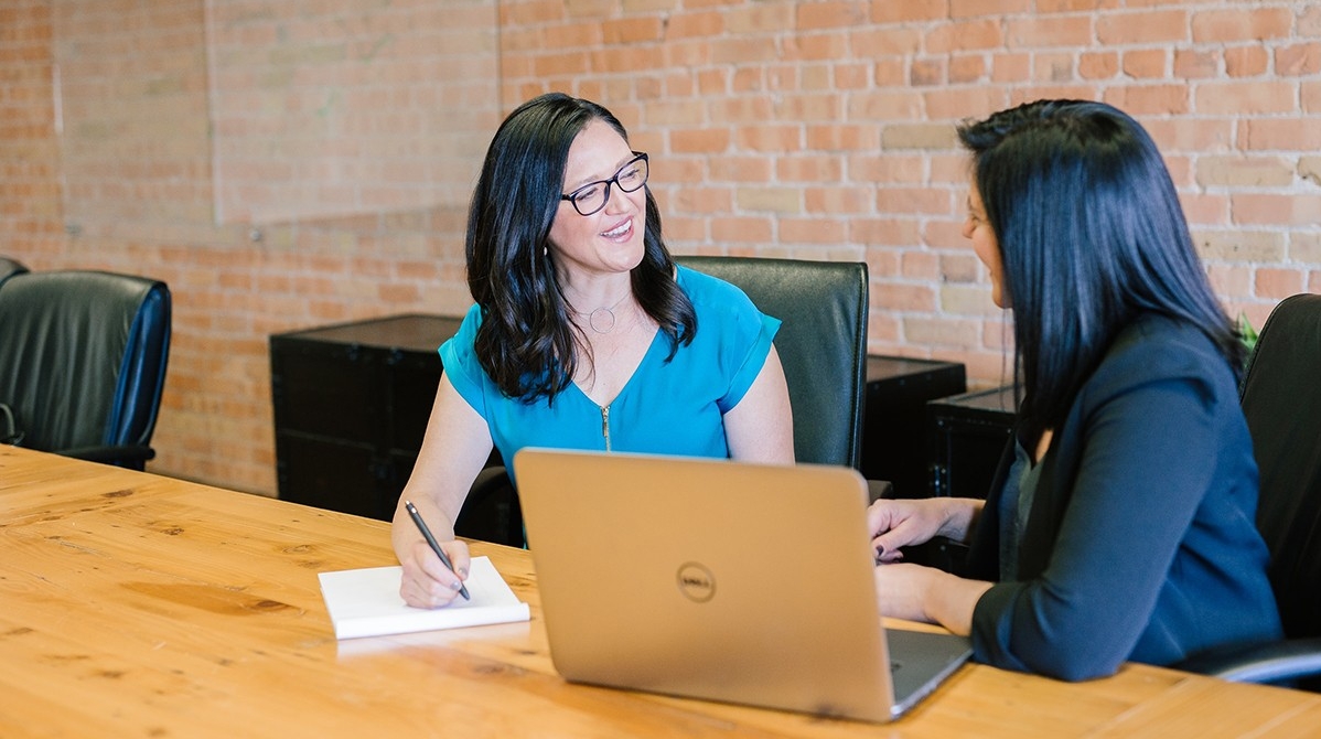 Two women working at a desk