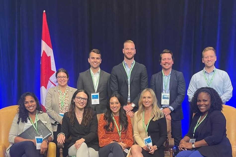 Lisa Malachowski (top row, left) poses with the first MBA cohort invited to attend the 2022 Banff Global Business Forum.