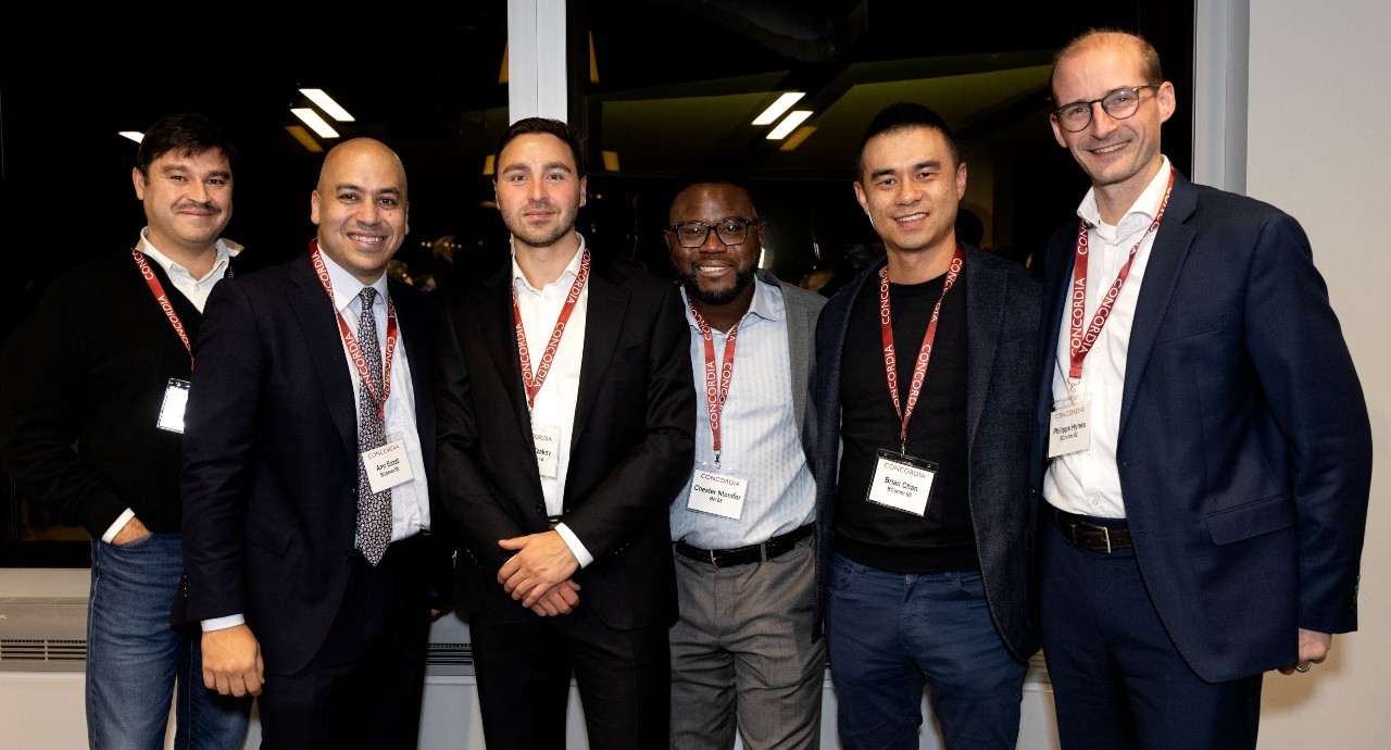 Group of KWPMP grads stand together. L to R: Amr Ezzat, Martin Tzakov, Chester Ntonifor, Brian Chan, Philippe Hynes