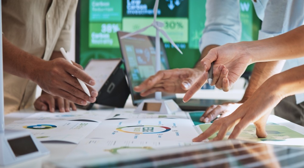 Sustainable finance team reviews data