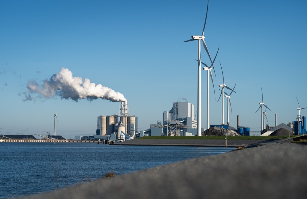 Fossil fuel station and wind turbines