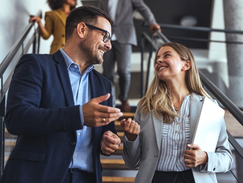 Two colleagues in conversation