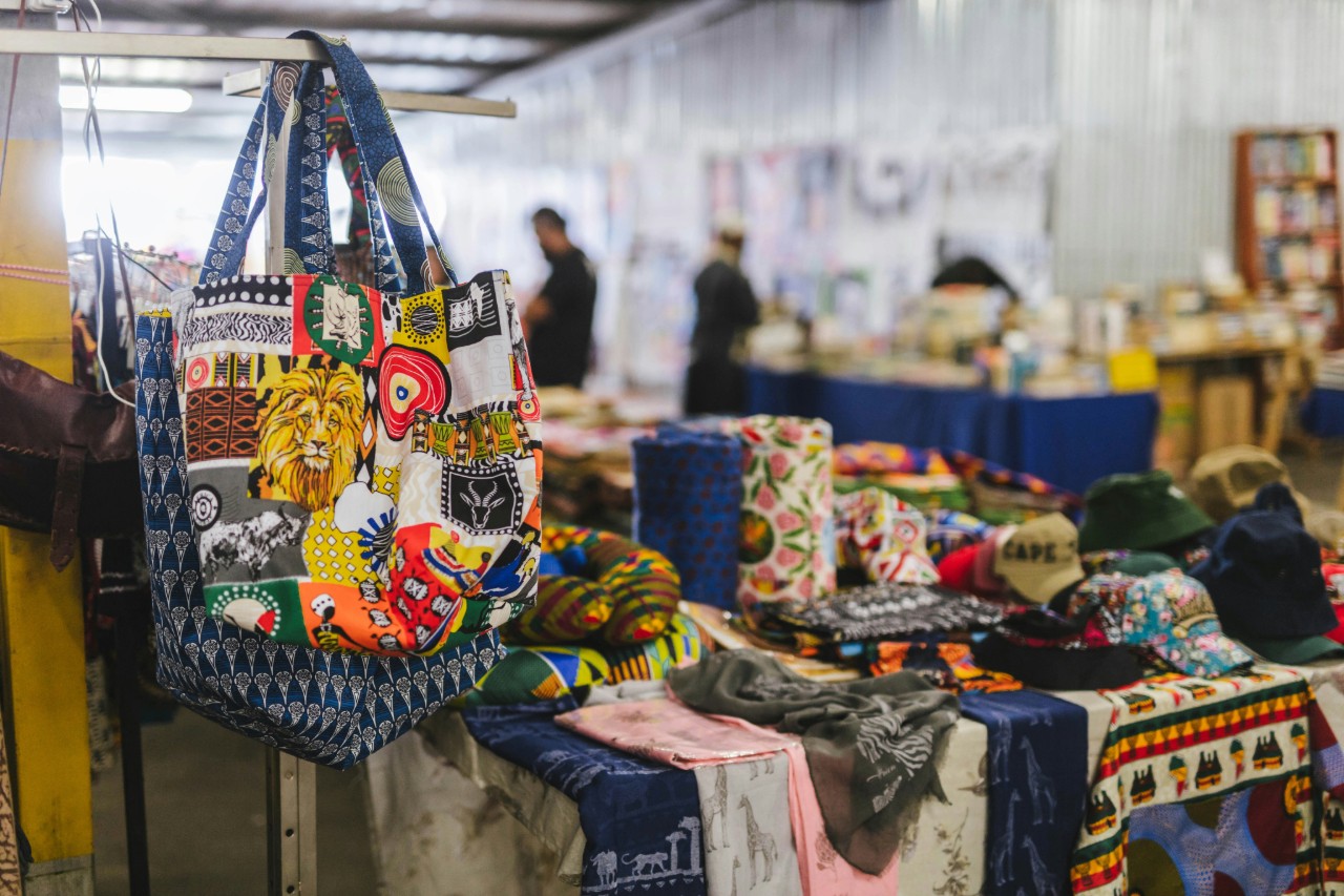 Flea market table with bags and clothing in Johannesburg, South Africa