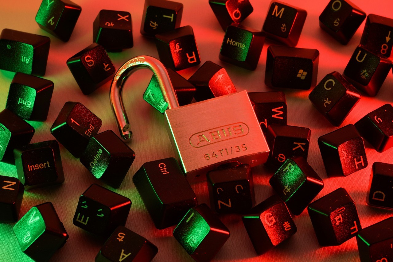 Photo by FlyD on Unsplash Padlock and keyboard keys scattered on table to represent cybersecurity