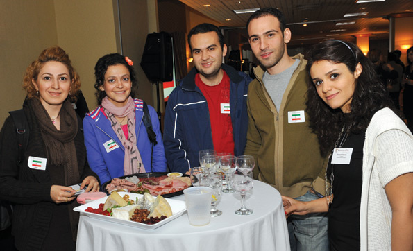 Nazanin Hazrati (right), VP Internal of the Graduate Students Association, stands with four newIranian Concordians. | Photo by Ryan Blau/PBL Photography