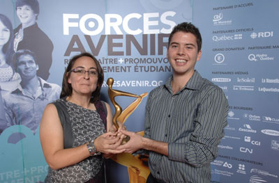 Annie Girard, a history teacher at École Internationale de Montéal, presents Manuel Abellan with Forces AVENIR award.
