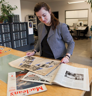 Art History PhD student Zoë Tousignant reviews magazines in the collection at the GrandeBibliothèque. | Photo by Concordia University