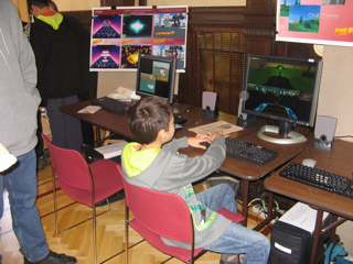 A youngster tries out a computer at Exposcience.