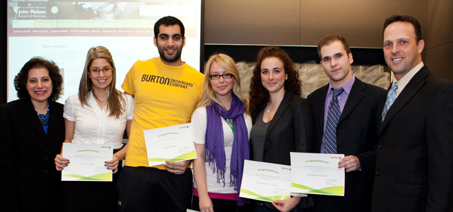 The winning team accepts their award in class on November 30. From left to right, Department of Marketing professor and chair Lea Katsanis, Tanya Caristo, Zeyad Saadeh, Stephanie Laurin, Gabrielle Faraggi, Jonathan O’Connell, and Michel Blais, Recruiting Specialist at Xerox Canada Ltee. | Photo by Concordia University