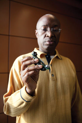 Tier 2 Canada Research Chair Roch H. Glitho holds up a sensor he is using to develop new applications for cellphones. The sensor can measure aspects of space, physiology and environment, for example, location via GPS, blood pressure and luminosity. He anticipatessuch sensors will be integrated into phones in the near future. | Photo by Concordia university