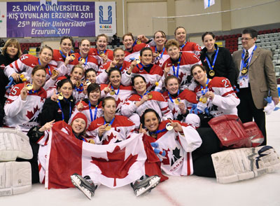 Stingers head coach Les Lawton (right) poses with the Canadian women’s hockey team at the Universiade in Turkey.
