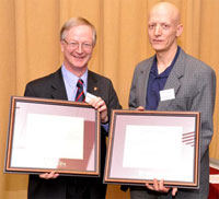 Dean Robin Drew presents Professor Mamoun Medraj with commemorative plaques. | Photo by Marc Bourcier