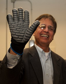Engineering professor Subhash Rakheja shows off the anti-vibration glove he’s testing in his lab. | Photo by Concordia University
