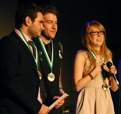 (Left to right) Samuel Brisson, Ryan George, and Sabrina Allard accept the gold medal for video production at the 2011 Jeux Franco-Canadiens de la communication. | Image courtesy of Charles D'Amboise