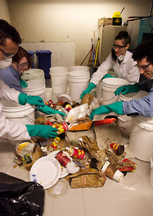 Left to right: Kenneth Sedgwick, Michaela Ryan, Alex Dimitrova and Faisal Shennib assess the trash from a bag found in J.W. McConnell Library Building. | Photo by Concordia University