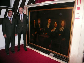 Epstein stands with Jasper Meyers, McGill Alumni Association representative in the Netherlands, next to the returned artwork still in its packaging from its voyage from Cologne to Amsterdam.