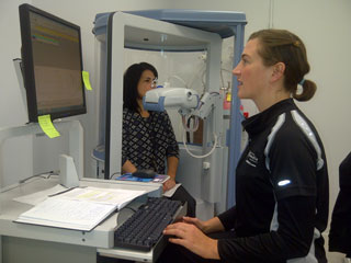 Third-year exercise science student and PERFORM intern Lindsay Hacker (right) conducts tests on one of the centre's plethysmographs. | Photo by Christian Durand