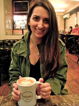 Haley Firkser enjoys a cup of coffee