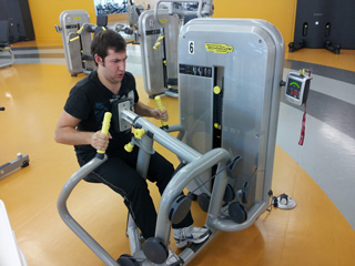 The low row machine puts David through his paces. | Photo by Sebastian Buna