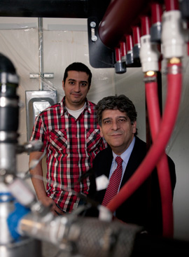 Georgios Vatistas with his newly engineered swirl-flow heat exchanger. | Photo by Concordia University