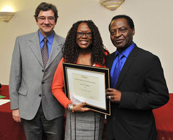 From left, David Thirlwall, associate university librarian and chair of the selection committee, with the winner of the Freda Otchere Staff Recognition Award Faye Corbin and Economics Professor Dan Otchere, creator of the award. | Photo by Ryan Blau, PBL Photography