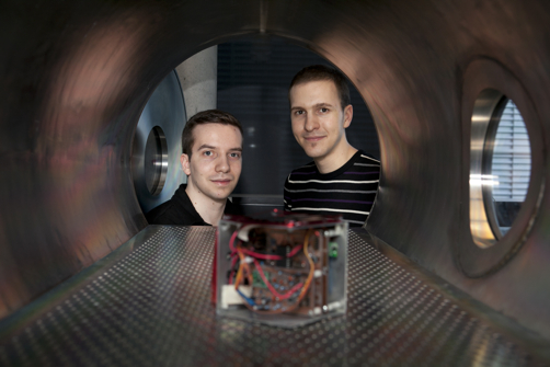 Space Concordia President Nicholas Sweet (on left) and teammate Gregory Gibson in the space chamber with a prototype CubeSat similar to what they've got planned.