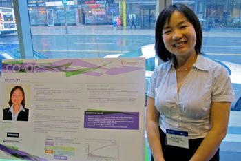 Ying Ying Jan proudly displays her poster about her three work terms at Bombardier Aerospace, Pratt & Whiney Canada and Solaxi.