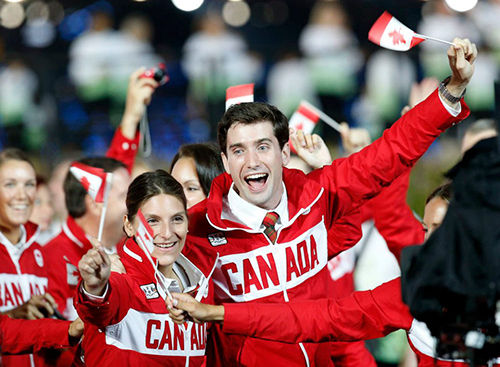 Olympic fencer Philippe Beaudry, a finance student at Concordia, celebrates with friends during the Opening Ceremonies of the Olympics in London. | Photo by 