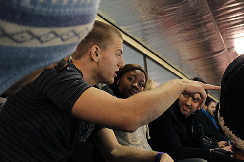 Former Stingers hockey player Stefan Lutzenkirchen explains Canada’s favourite game to Jennifer Okolo and Payam Vaseghi, who are taking part in the GradConnect series of networking events. | Photo courtesy of GradProSkills