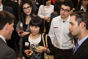 Students mingle with Filip Papich, managing director, BMO Capital Markets. | Photo by Josée Lecompte
