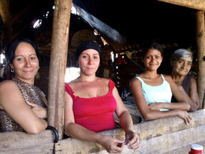 The Reina family: Liudmila, Liuwitza, Edelennis and Reyna in the small kitchen at the family farm outside Bartolome Maso, Cuba. | Photo by Melanie Gallant