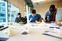 This student team is developing a chair that would sense and respond to an individual’s posture. | Photo by Emily Gan