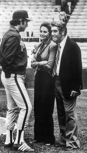 Kay in 1984, at an all-stars baseball game. She is standing with Jim Fregosi (left), manager of the California Angels, and Joe Mooshil, sports writer for the Associated Press. 