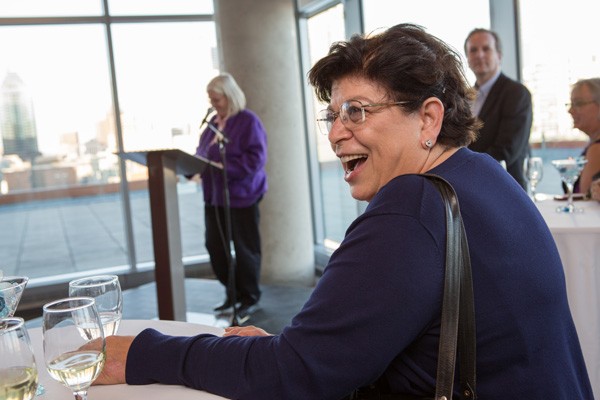 Maria Peluso is toasted by friends and colleagues at a party in her honour. 