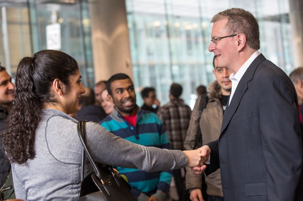 President Alan Shepard greets a student