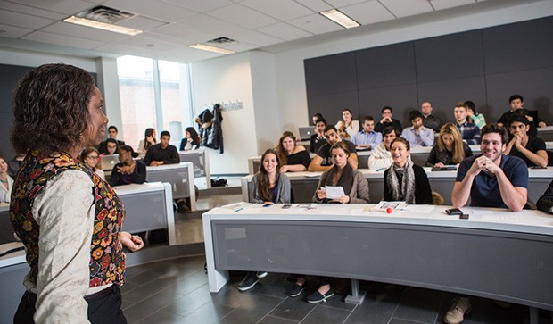 Linda Dyer, Professor and Chair of the Department of Management lectures to a classroom of engaged students