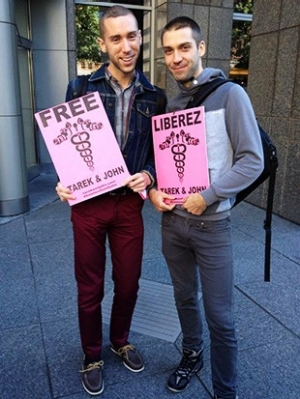Ian Bradley-Perrin and Ryan Conrad protesting for the release of Tarek Loubani and John Greyson from prison in Egypt 