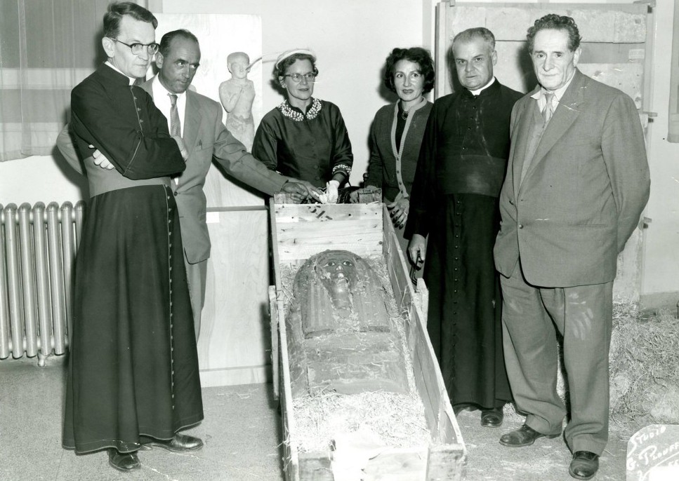 Olga and Vincent Diniacopoulos with clergy members and local dignitaries at the opening of the Valleyfield Seminary's archeology museum in 1954.