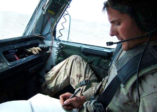 Joseph Leger takes down radio orders in the front seat of an RG-31 Nyala armoured personnel carrier in Afghanistan. | Photos courtesy of  Joseph Leger