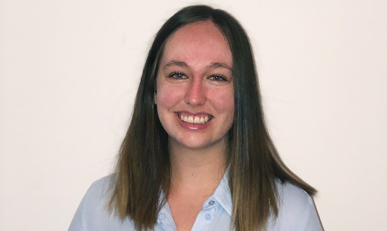 Young smiling woman with long, brown hair.