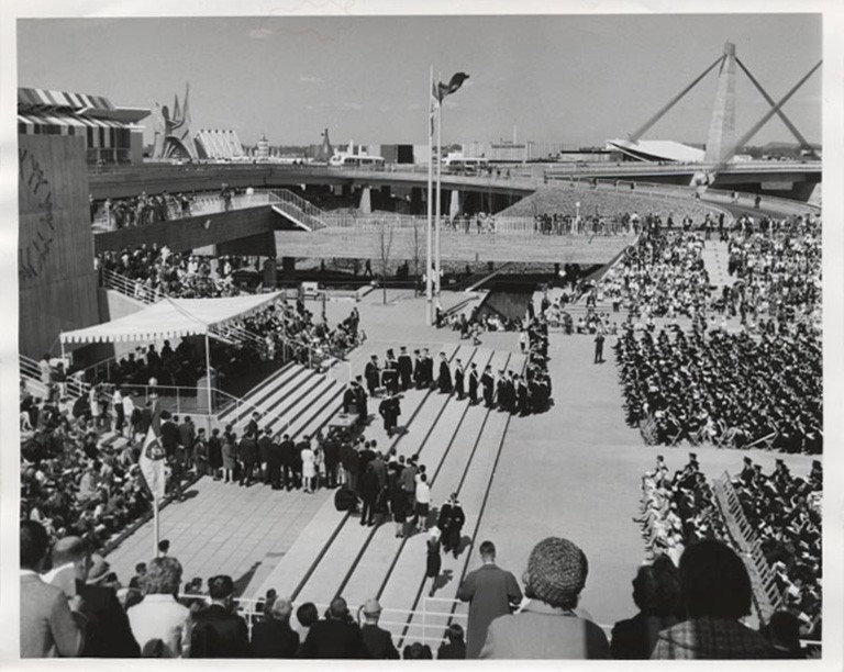 The 1967 spring convocation of Sir George Williams University, held at the Expo 67 site. Black and white archive image from 1967 of a university convocation held outdoors.