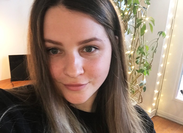 Charlotte Savage: “I plan to one day create an inclusive community for minorities to explore sustainable technology.” Young, smiling woman with long, dark hair.
