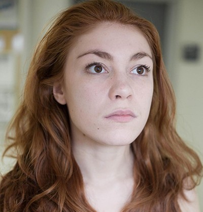 Young woman with long, strawberry blonde hair.